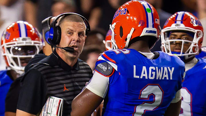 Florida Gators head coach Billy Napier talks with Florida Gators quarterback DJ Lagway (2) during the first half at Ben Hill Griffin Stadium in Gainesville, FL on Saturday, October 5, 2024. [Doug Engle/Gainesville Sun]