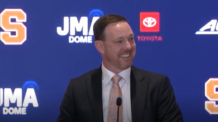 March 30, 2026; Syracuse, N.Y., USA; New Syracuse Orange head coach Gerry McNamara smiles as he addresses the overflow crowd at his official introduction at Miron Victory Court. Mandatory Credit: Screen shot courtesy of Syracuse University Athletic Communications 