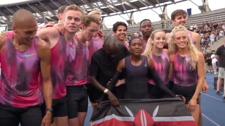 Georgia Hunter Bell (second from right) celebrates after Faith Kipyegon's bid for history
