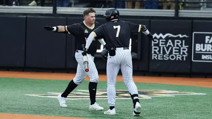 Southern Miss players Matthew Russon and Ben Higdon celebrate.