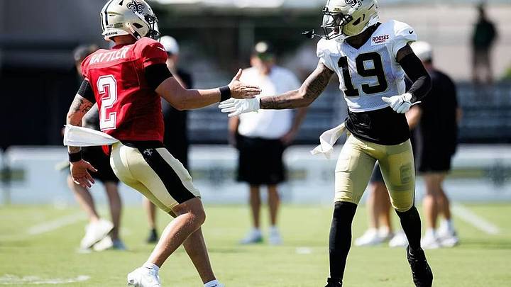 New Orleans Saints quarterback Spencer Rattler (left) and receiver Barion Brown (right) handshake after making a play at training camp. New Orleans Saints quarterback Spencer Rattler (left) and receiver Barion Brown (right) handshake after making a play at training camp.