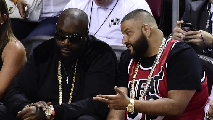 Jun 10, 2014; Miami, FL, USA; Recording artists Rick Ross (left) and DJ Khaled (right) watch the game between the Miami Heat and the San Antonio Spurs during the second half of game three of the 2014 NBA Finals at American Airlines Arena. Mandatory Credit: Bob Donnan-Imagn Images