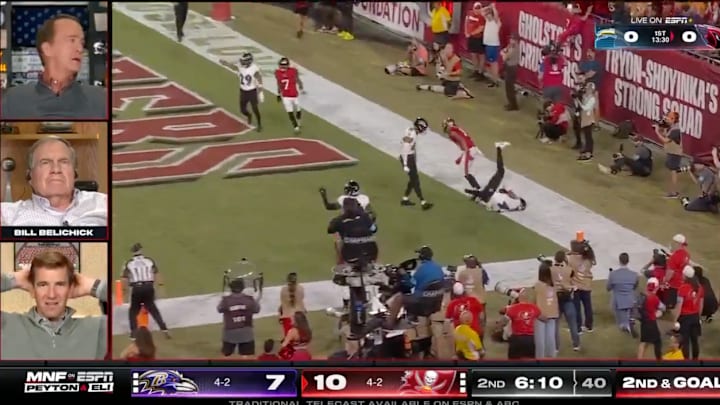 Peyton Manning, Bill Belichick and Eli Manning react to a Baker Mayfield interception. 