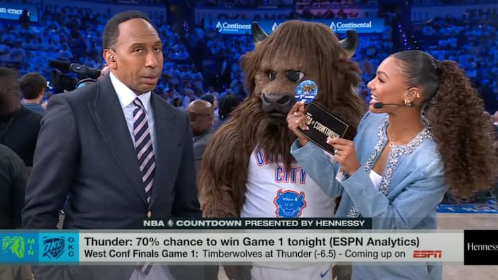 Stephen A. Smith reacts to Malika Andrews being given a button.