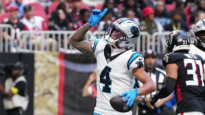 Nov 16, 2025; Atlanta, Georgia, USA; Carolina Panthers wide receiver Tetairoa McMillan (4) celebrates a touchdown in the first quarter against the Atlanta Falcons at Mercedes-Benz Stadium. Nov 16, 2025; Atlanta, Georgia, USA; Carolina Panthers wide receiver Tetairoa McMillan (4) celebrates a touchdown in the first quarter against the Atlanta Falcons at Mercedes-Benz Stadium.