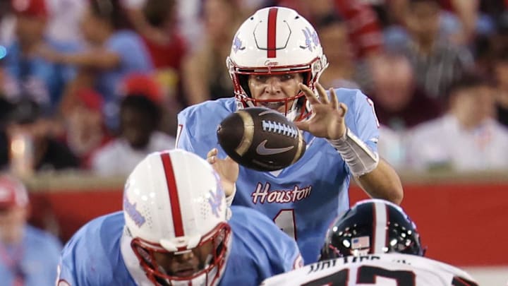 Oct 4, 2025; Houston, Texas, USA; Houston Cougars quarterback Conner Weigman (1) has the ball hiked to him against the Texas Tech Raiders in the first half at TDECU Stadium. Mandatory Credit: Thomas Shea-Imagn Images