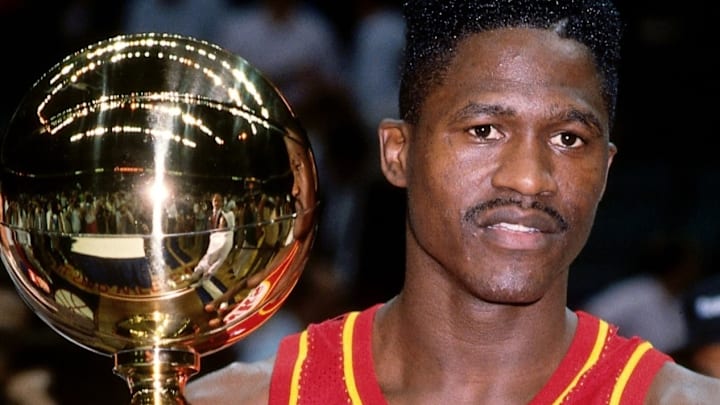 Dominique Wilkins holding the Gatorade Slam Dunk trophy Dominique Wilkins holding the Gatorade Slam Dunk trophy