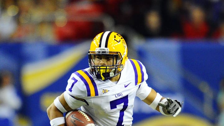 Dec 3, 2011; Atlanta, GA, USA; LSU Tigers cornerback Tyrann Mathieu (7) returns a punt during the second half of the 2011 SEC championship game against the Georgia Bulldogs at the Georgia Dome.  Mandatory Credit: Dale Zanine-USA TODAY Sports