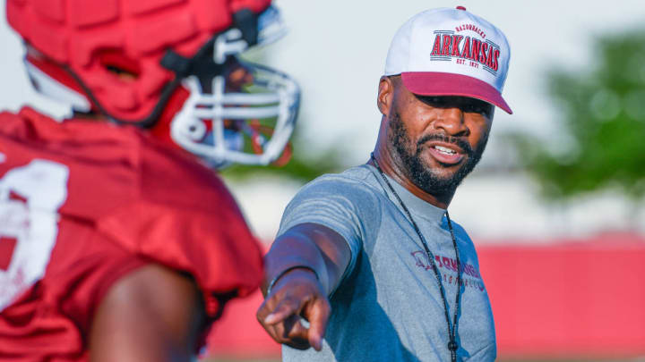 Arkansas Razorbacks co-defensive coordinator Travis Williams coaching the linebackers at practice.