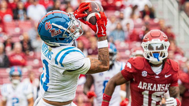 Ole Miss Rebels wide receiver Jordan Watkins gets behind Arkansas Razorbacks safety TJ Metcalf on his way to one of five touchdowns at Razorback Stadium in Fayetteville, Ark.