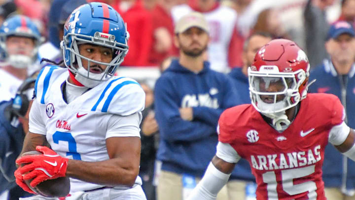 Arkansas Razorbacks defensive back Jaheim Singletary having to rush up as Ole Miss wide receiver Antwane "Juice" Wells catches a pass from Jaxson Dart at Razorback Stadium in Fayetteville, Ark.