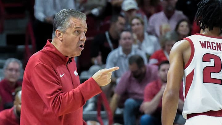 Arkansas Razorbacks coach John Calipari directing DJ Wagner in the exhibition opener against the Kansas Jayhawks at Bud Walton Arena in Fayetteville, Ark.
