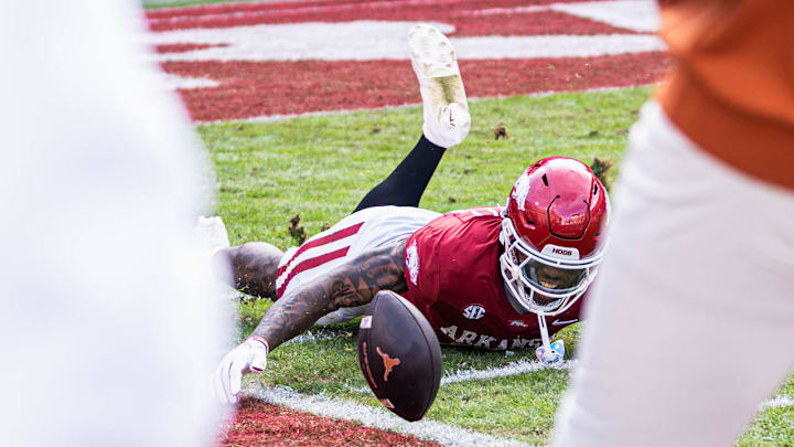 When the Texas Longhorns fumbled in the fourth quarter, the Arkansas Razorbacks' defense couldn't quite get to the ball before it bounced out of bounds, leaving Texas with a first down.
