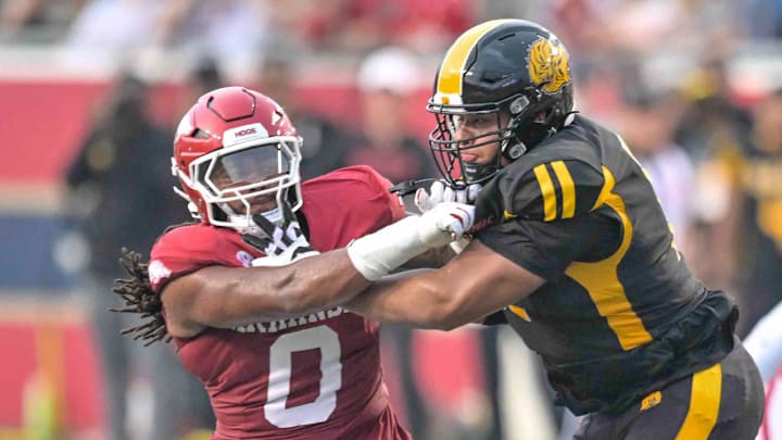 Arkansas Razorbacks defensive end Nico Davillier tries to get past a block against UAPB in the season opener at War Memorial Stadium in Little Rock, Ark.