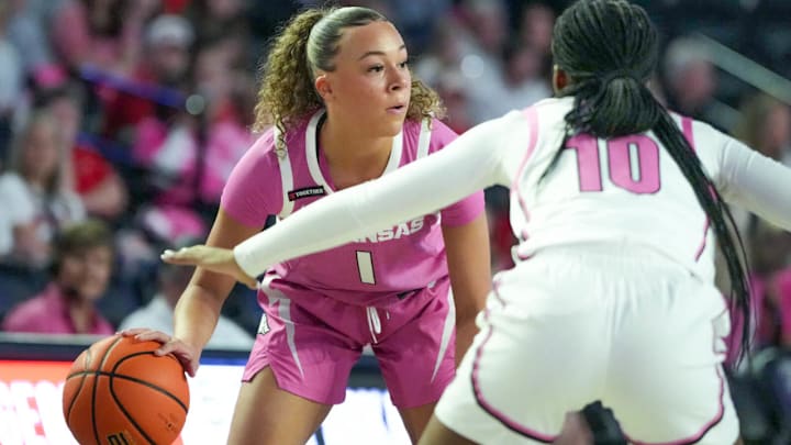 Arkansas Razorbacks guard Phoenix Sotjin looks for an opening against the Georgia Bulldogs in a game in Athens, Ga.