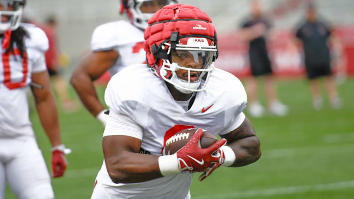Arkansas Razorbacks running back Braylen Russell takes off during spring practice drills inside Razorback Stadium.