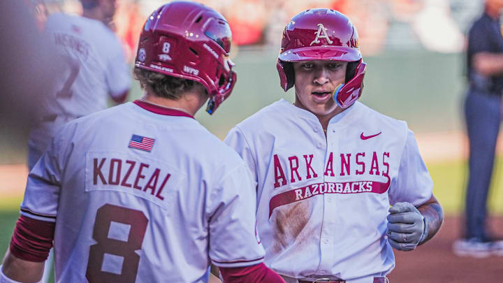 Arkansas Razorbacks designated hitter Kuhio Aloy crosses home after a homer against UCA at Baum-Walker Stadium in Fayetteville, Ark.