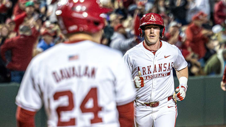 Arkansas Razorbacks Logan Maxwell comes to the plate after hitting a home run against the South Carolina Gamecocks at Baum-Walker Stadium in Fayetteville, Ark. Arkansas Razorbacks Logan Maxwell comes to the plate after hitting a home run against the South Carolina Gamecocks at Baum-Walker Stadium in Fayetteville, Ark.