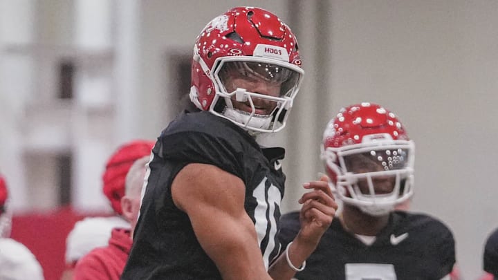 Arkansas Razorbacks quarterback Taylen Green throwing a pass during practices indoors in Fayetteville, Ark.