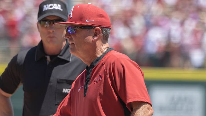Arkansas Razorbacks coach Dave Van Horn delivering the lineup card before Sunday's second game against the Tennessee Volunteers in the NCAA Super Regional at Baum-Walker Stadium in Fayetteville, Ark.