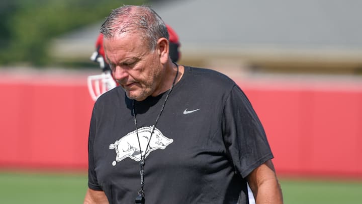 Arkansas Razorbacks coach Sam Pittman walking the field during Sunday's fall camp practices on the outdoor fields in Fayetteville, Ark.