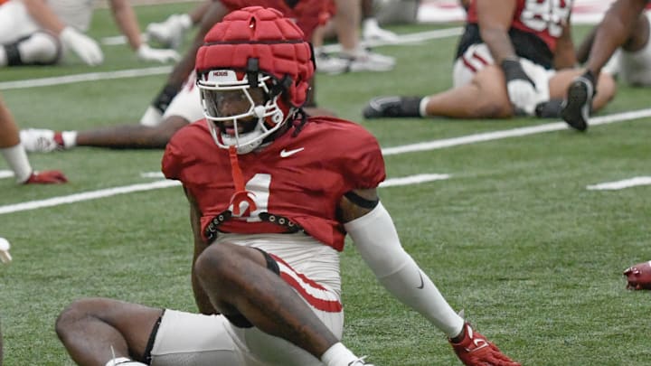 Arkansas Razorbacks defensive back Jordan Young warming up before a preseason practice indoors in Fayetteville, Ark.