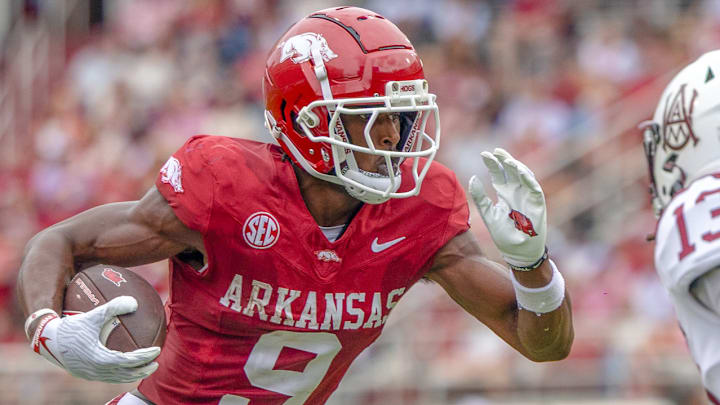 Arkansas Razorbacks wide receiver O'Mega Blake runs after making one of his 7 catches against the Alabama A&M Bulldogs at Razorback Stadium in Fayetteville, Ark.