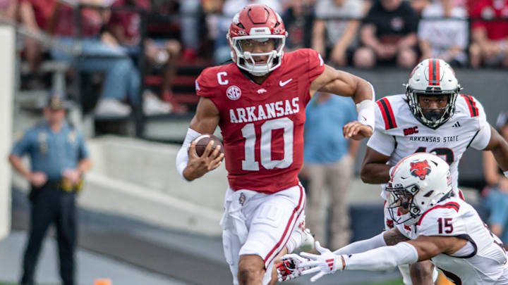 Arkansas Razorbacks quarterback Taylen Green out-runs an Arkansas State Red Wolves defender at Razorback Stadium in Fayetteville, Ark.