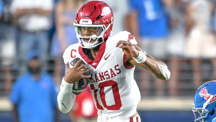 Arkansas Razorbacks quarterback Taylen Green scrambling against the Ole Miss Rebels at Vaught-Hemingway Stadium in Oxford, Miss.