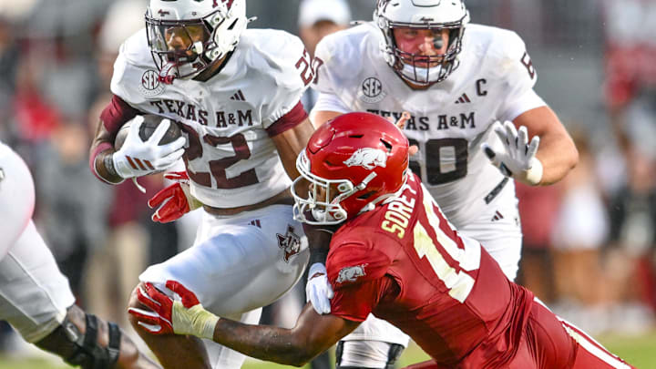 Arkansas Razorbacks linebacker Xavian Sorey tries to make a tackle on Texas A&M Aggies running back EJ Smith during game at Razorback Stadium in Fayetteville, Ark. Arkansas Razorbacks linebacker Xavian Sorey tries to make a tackle on Texas A&M Aggies running back EJ Smith during game at Razorback Stadium in Fayetteville, Ark.