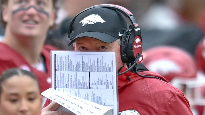 Arkansas Razorbacks coach Bobby Petrino looks over his notes during game with the Auburn Tigers at Razorback Stadium in Fayetteville, Ark.