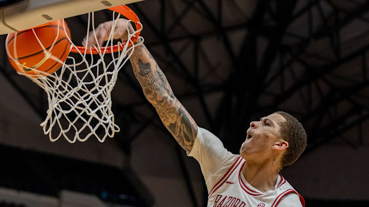 Arkansas Razorbacks forward Trevon Brazile dunking against the Texas Tech Red Raiders in a game at American Airlines Center in Dallas.