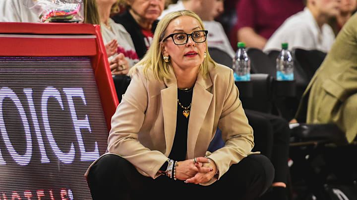 Arkansas Razorbacks coach Kelsi Musick on the sidelines during game against the Arkansas State Red Wolves at Bud Walton Arena in Fayetteville, Ark.
