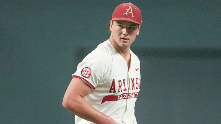 Arkansas Razorbacks pitcher Gabe Gaeckle walks off the mound during game against the Oklahoma State Cowboys at Globe Life Field in Arlington, Texas in the Shriners Children's College Showdown.