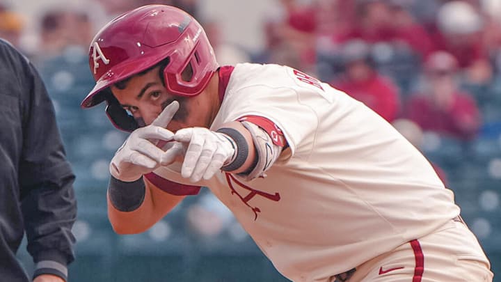 Arkansas Razorbacks catcher Ryder Helfrick reacting after a big hit Sunday during game against the UT Arlington Mavericks at Baum-Walker Stadium in Fayetteville, Ark.