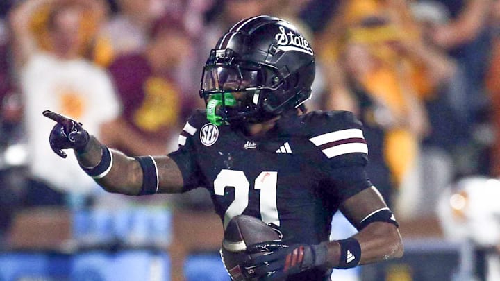 Mississippi State Bulldogs defensive back Hunter Washington (21) reacts after a interception during the fourth quarter against the Arizona State Sun Devils at Davis Wade Stadium at Scott Field.