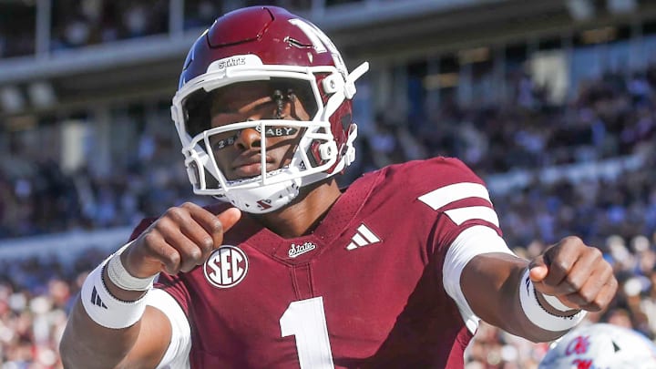 Mississippi State Bulldogs quarterback Kamario Taylor (1) celebrates after scoring a touchdown against the Ole Miss Rebels in the first half at Davis Wade Stadium at Scott Field.