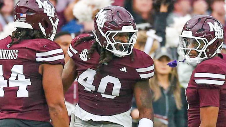 Mississippi State Bulldogs linebacker Nic Mitchell (40) reacts with linebacker Branden Jennings (44) and defensive back Isaac Smith (2) after a defensive stop during the second quarter against the Texas Longhorns at Davis Wade Stadium at Scott Field.