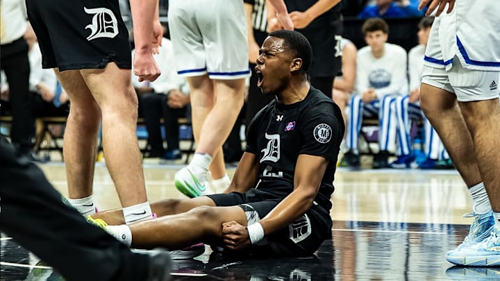 Ian Thomas celebrates an and-one against Rockhurst in the state semifinal. De Smet finishes ranked 3rd in the state. 