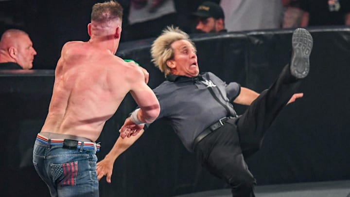 Charles Robinson is prevented from entering the ring by John Cena via a vicious pounce at WWE Night of Champions Charles Robinson is prevented from entering the ring by John Cena via a vicious pounce at WWE Night of Champions