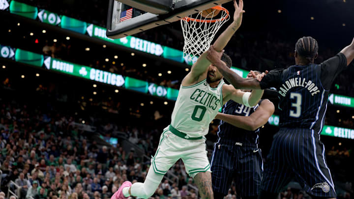 Boston's Jayson Tatum is fouled by Orlando's Kentavious Caldwell-Pope in Game 1 of their first-round NBA playoff series.