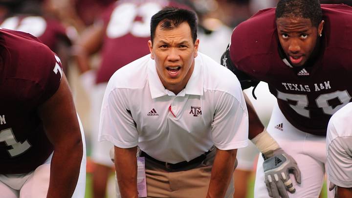 Dat Nguyen, during his time as the inside linebackers coach for Texas A&M (2010–2011), is captured pre-game on the field, locked in alongside his players, including defensive lineman Tony Jerod-Eddie (#70) on his right. Dat Nguyen, during his time as the inside linebackers coach for Texas A&M (2010–2011), is captured pre-game on the field, locked in alongside his players, including defensive lineman Tony Jerod-Eddie (#70) on his right.