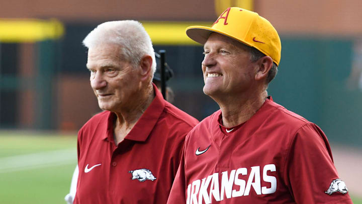 Former Arkansas Razorbacks coach Norm DeBriyn and current coach Dave Van Horn at a game on April 30, 2024, at Baum-Walker Stadium.