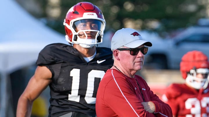 Arkansas Razorbacks offensive coordinator Bobby Petrino working with quarterback Taylen Green at Saturday's practice on the outdoor fields in Fayetteville, Ark.