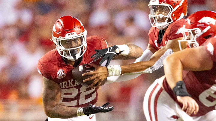 Arkansas Razorbacks running back Ja'Quinden Jackson takes a handoff from quarterback Taylen Green against the Tennessee Volunteers at Razorback Stadium in Fayetteville, Ark.