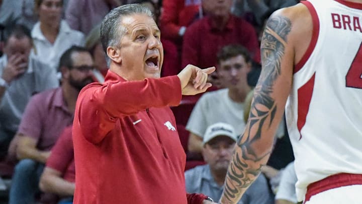 Arkansas Razorbacks coach John Calipari directing his team against Kansas in an exhbition opener against Kansas at Bud Walton Arena in Fayetteville, Ark. Arkansas Razorbacks coach John Calipari directing his team against Kansas in an exhbition opener against Kansas at Bud Walton Arena in Fayetteville, Ark.