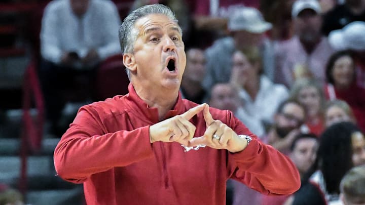 Arkansas Razorbacks coach John Calipari motions in a play during an exhibition game against the Kansas Jayhawks at Bud Walton Arena in Fayetteville, Ark.