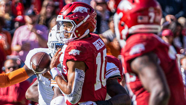 Arkansas Razorbacks quarterback juggles a snap from center in a game against the Texas Longhorns at Razorback Stadium in Fayetteville, Ark.