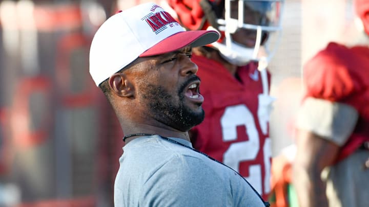 Arkansas Razorbacks linebackers and defensive coordinator Travis Williams reacts during drills in fall practice in August on the outdoor practice fields in Fayetteville, Ark. Arkansas Razorbacks linebackers and defensive coordinator Travis Williams reacts during drills in fall practice in August on the outdoor practice fields in Fayetteville, Ark.