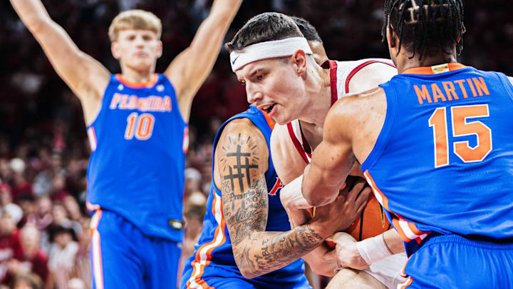Arkansas Razorbacks forward Zvonimir Ivisic fights to hold onto possession  against the Florida Gators at Bud Walton Arena in Fayetteville, Ark.